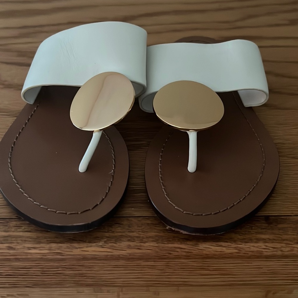 Gently used Tory Burch Patos Sandals in white and gold!